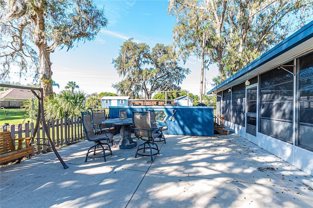 view of patio featuring fence