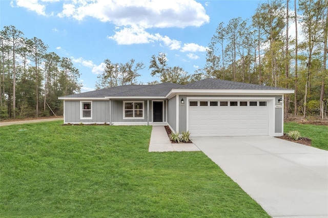 ranch-style house with an attached garage, concrete driveway, a shingled roof, and a front yard