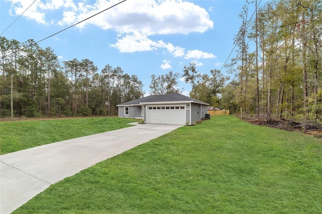 view of front of property with a garage, driveway, and a front yard