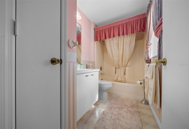 bathroom featuring wainscoting, toilet, tile patterned flooring, shower / bath combo with shower curtain, and vanity