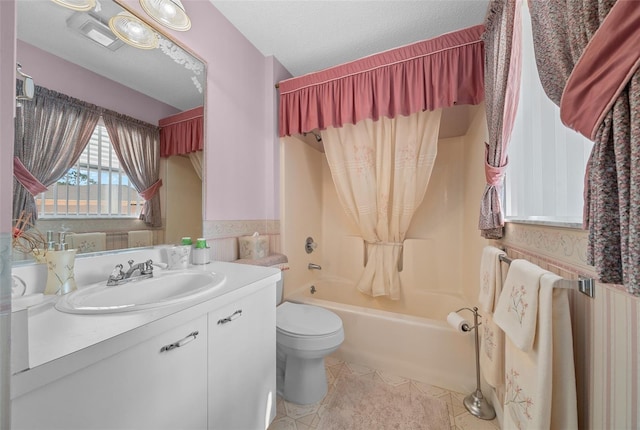 bathroom with shower / bath combination, toilet, tile patterned flooring, a textured ceiling, and vanity