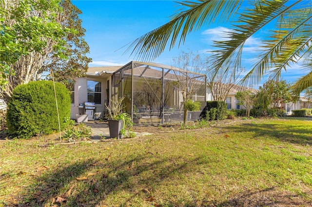 view of yard featuring glass enclosure