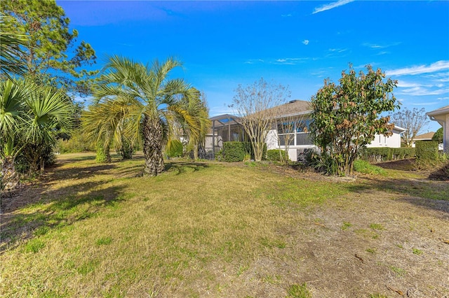 view of yard with a lanai