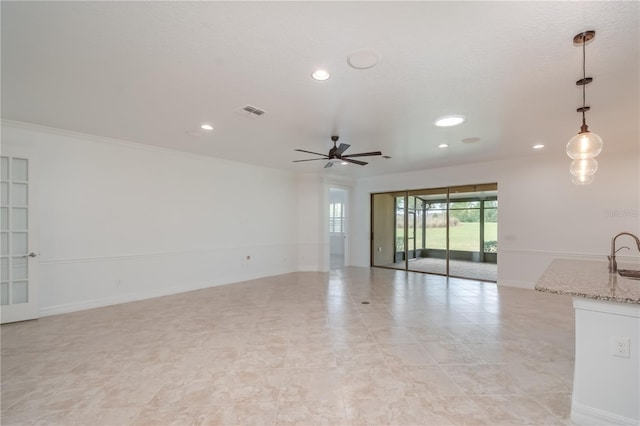 spare room featuring recessed lighting, visible vents, ceiling fan, and baseboards