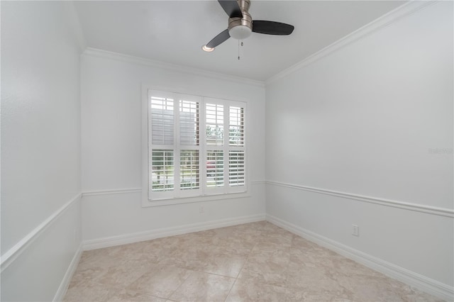 empty room featuring ornamental molding, ceiling fan, and baseboards