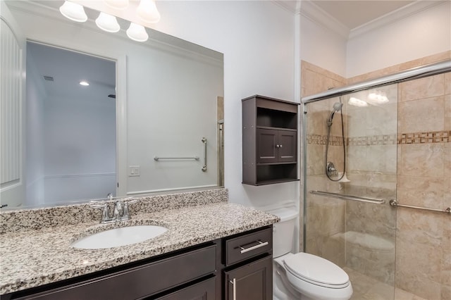 full bath with ornamental molding, a stall shower, vanity, and toilet