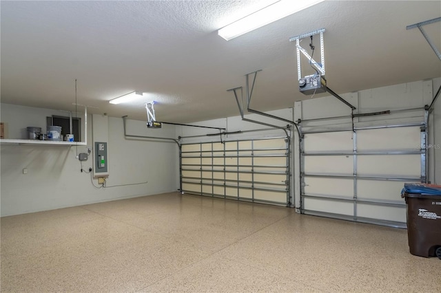 garage featuring electric panel and a garage door opener