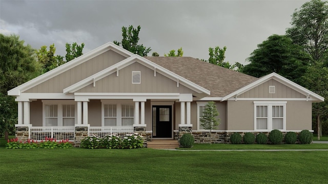 craftsman inspired home with stone siding, a shingled roof, a front lawn, and a porch