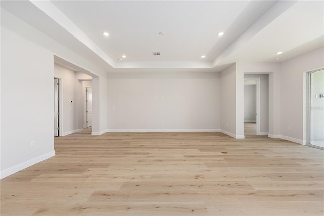 1929 NW 85th Loop, Ocala, FL 34475 - empty room with a raised ceiling, light wood finished floors, and recessed lighting