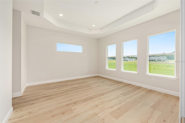 1929 NW 85th Loop, Ocala, FL 34475 - empty room with a raised ceiling, light wood-type flooring, and recessed lighting