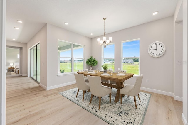 1929 NW 85th Loop, Ocala, FL 34475 - dining room featuring light wood finished floors, a chandelier, and recessed lighting