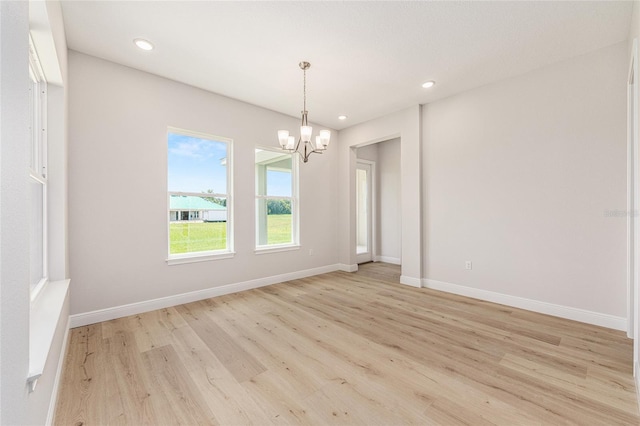 1929 NW 85th Loop, Ocala, FL 34475 - empty room featuring a chandelier, light wood-type flooring, and recessed lighting
