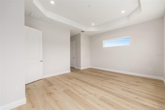 1929 NW 85th Loop, Ocala, FL 34475 - unfurnished room with a raised ceiling, light wood finished floors, and recessed lighting
