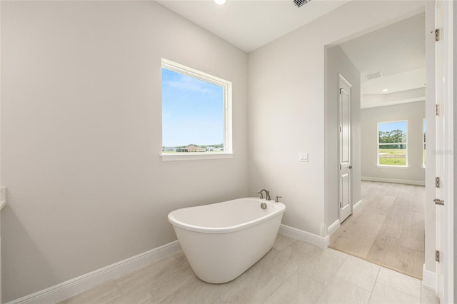 1929 NW 85th Loop, Ocala, FL 34475 - full bath with a freestanding bath and recessed lighting