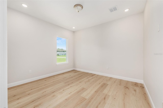 1929 NW 85th Loop, Ocala, FL 34475 - spare room featuring wood finished floors and recessed lighting