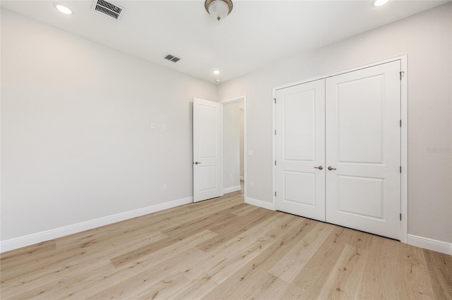 1929 NW 85th Loop, Ocala, FL 34475 - unfurnished bedroom featuring light wood-style floors, recessed lighting, and a closet