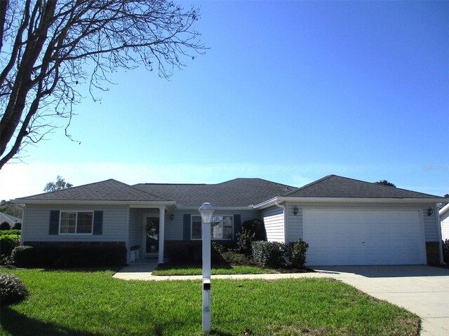 single story home with an attached garage, driveway, a front lawn, and roof with shingles