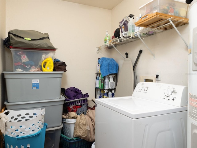 laundry area featuring washer / dryer and laundry area