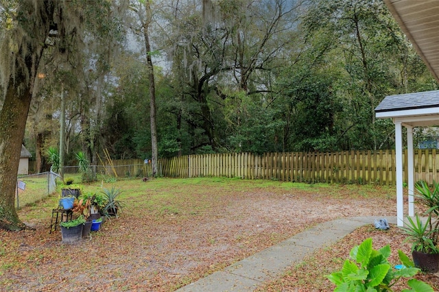 view of yard with a fenced backyard