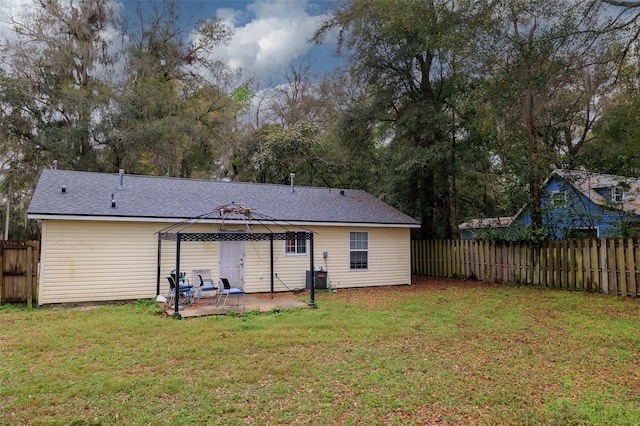 back of house with a gazebo, a lawn, a patio area, and fence private yard