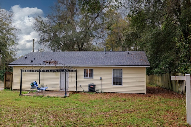 back of property featuring a patio, a yard, a gazebo, central AC unit, and fence