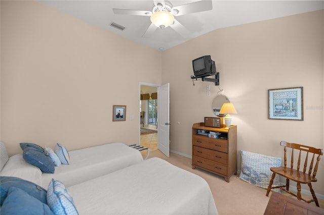 bedroom with light carpet, visible vents, baseboards, lofted ceiling, and ceiling fan