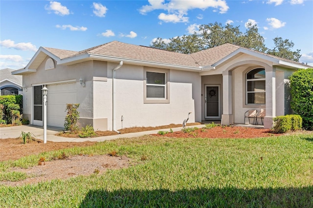 single story home featuring stucco siding, a shingled roof, an attached garage, a front yard, and driveway