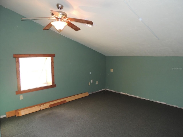 bonus room with vaulted ceiling, carpet floors, and a ceiling fan