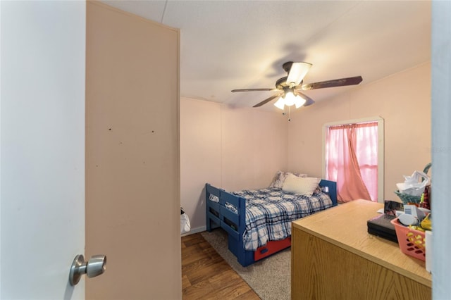 bedroom featuring ceiling fan and wood finished floors