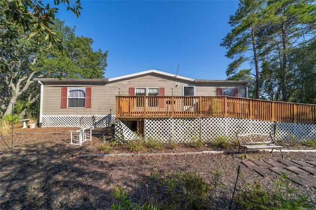 back of property featuring a deck