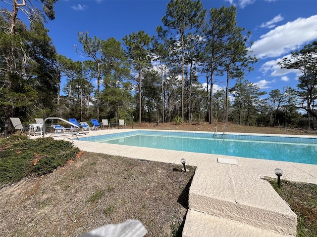 pool featuring a patio area