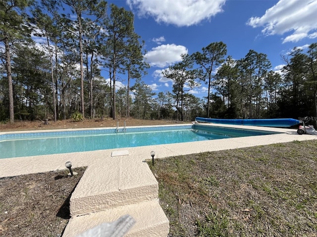 view of swimming pool featuring a covered pool