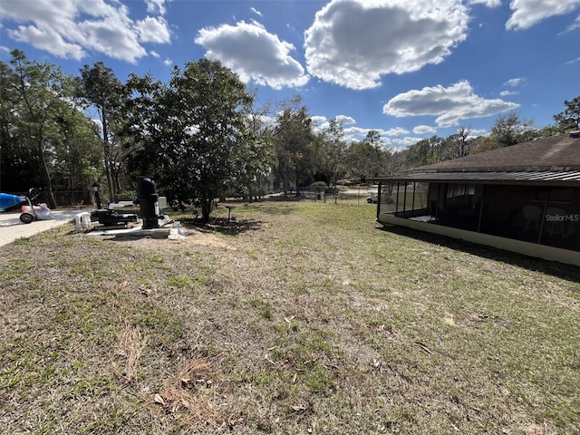 view of yard featuring a sunroom