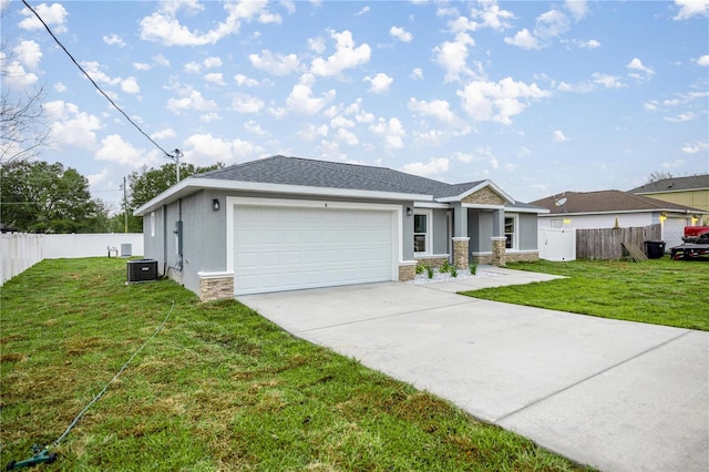 view of front of property featuring a garage, stone siding, fence, and a front lawn