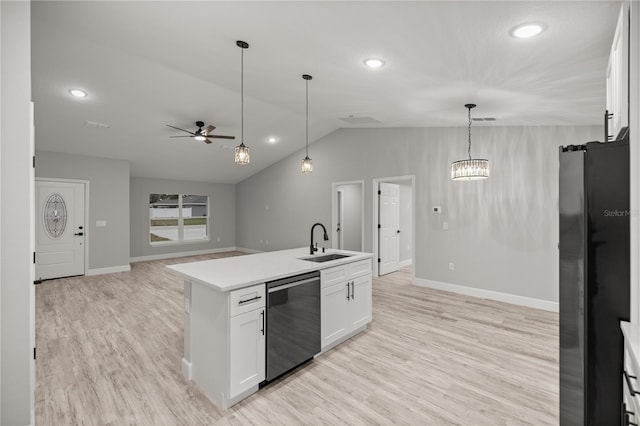 kitchen featuring a center island with sink, dishwashing machine, light countertops, white cabinetry, and a sink