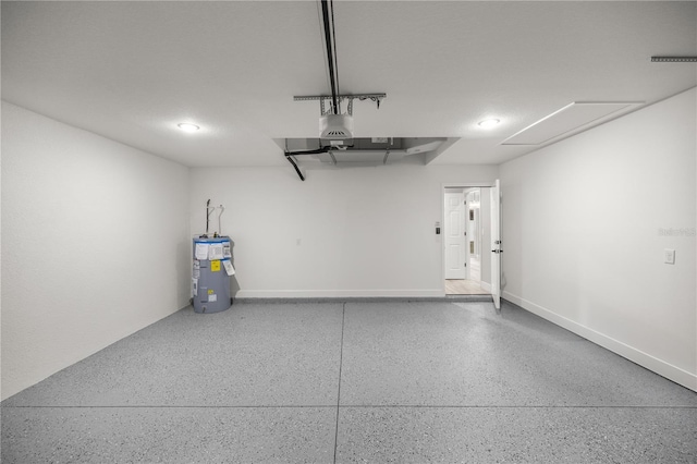 garage featuring water heater, baseboards, and a garage door opener