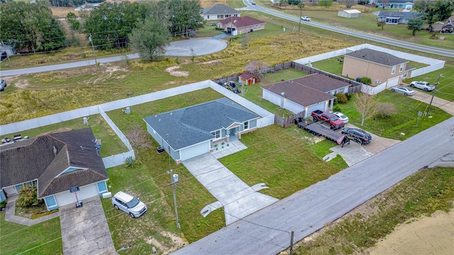 birds eye view of property with a residential view