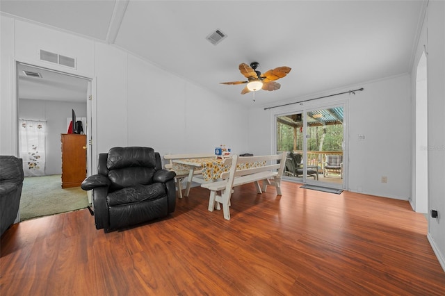 dining area with vaulted ceiling, wood finished floors, and visible vents