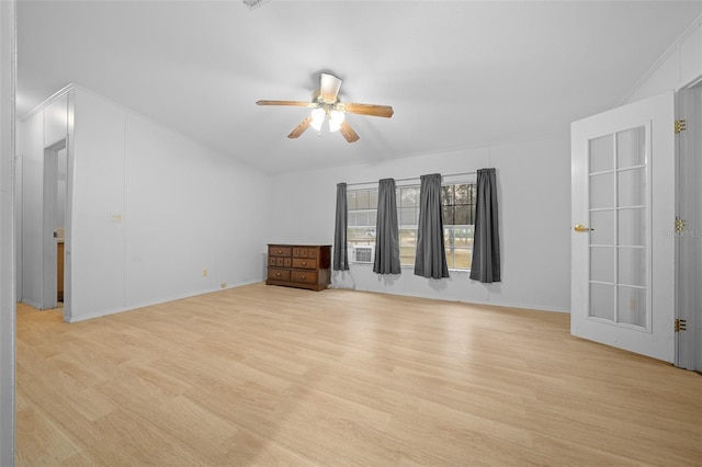 empty room featuring light wood-type flooring and a ceiling fan