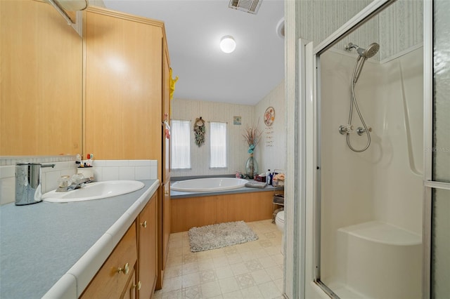 bathroom featuring wallpapered walls, visible vents, vanity, a shower stall, and a bath