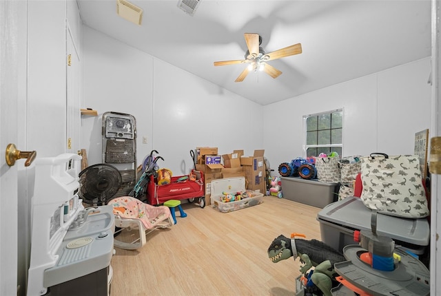 interior space with visible vents and a ceiling fan