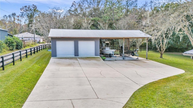 garage featuring a garage and fence