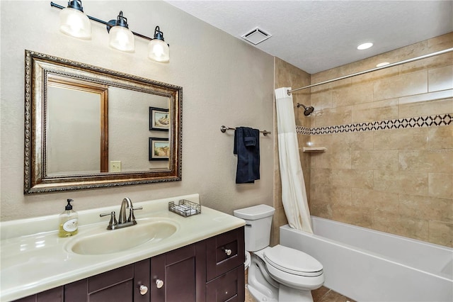 bathroom featuring a textured ceiling, toilet, vanity, visible vents, and shower / bath combination with curtain