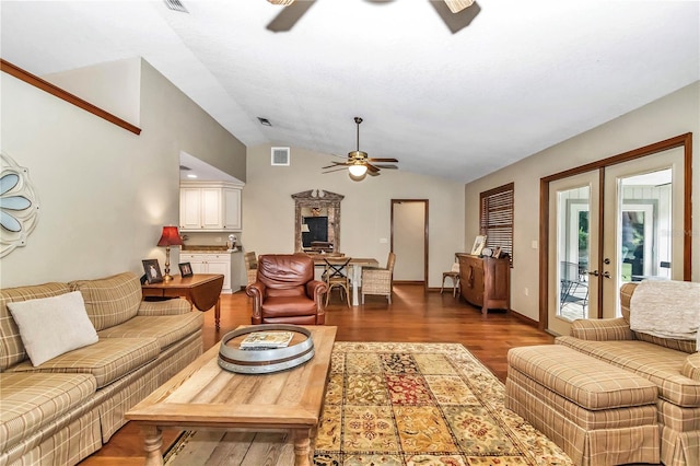 living room with ceiling fan, wood finished floors, visible vents, vaulted ceiling, and french doors