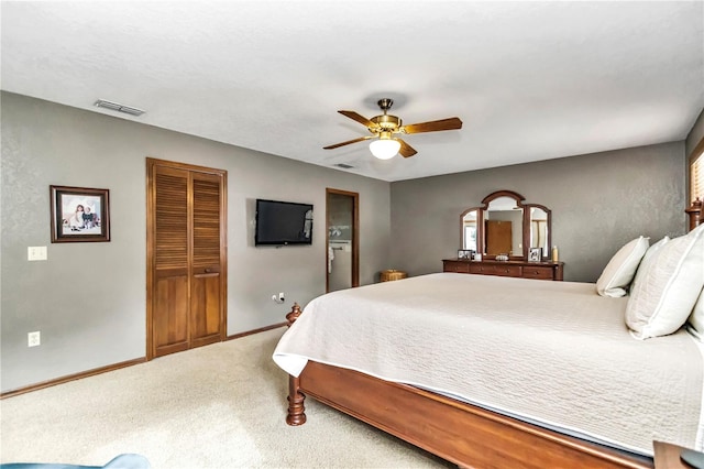 bedroom with carpet floors, baseboards, visible vents, and a ceiling fan