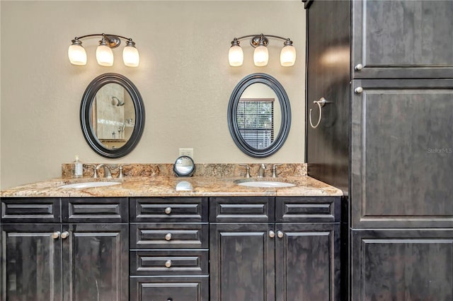 bathroom featuring double vanity and a sink