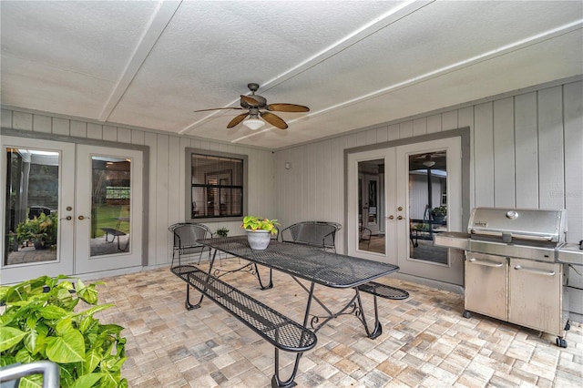 view of patio featuring french doors, grilling area, and a ceiling fan