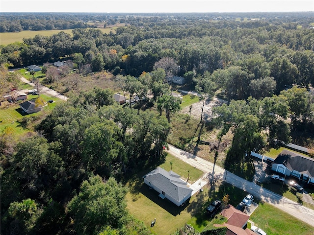 aerial view featuring a wooded view