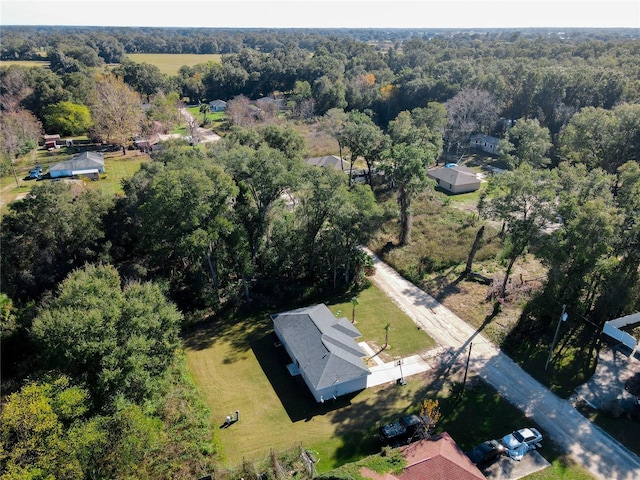 drone / aerial view with a view of trees