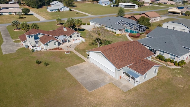 birds eye view of property with a residential view